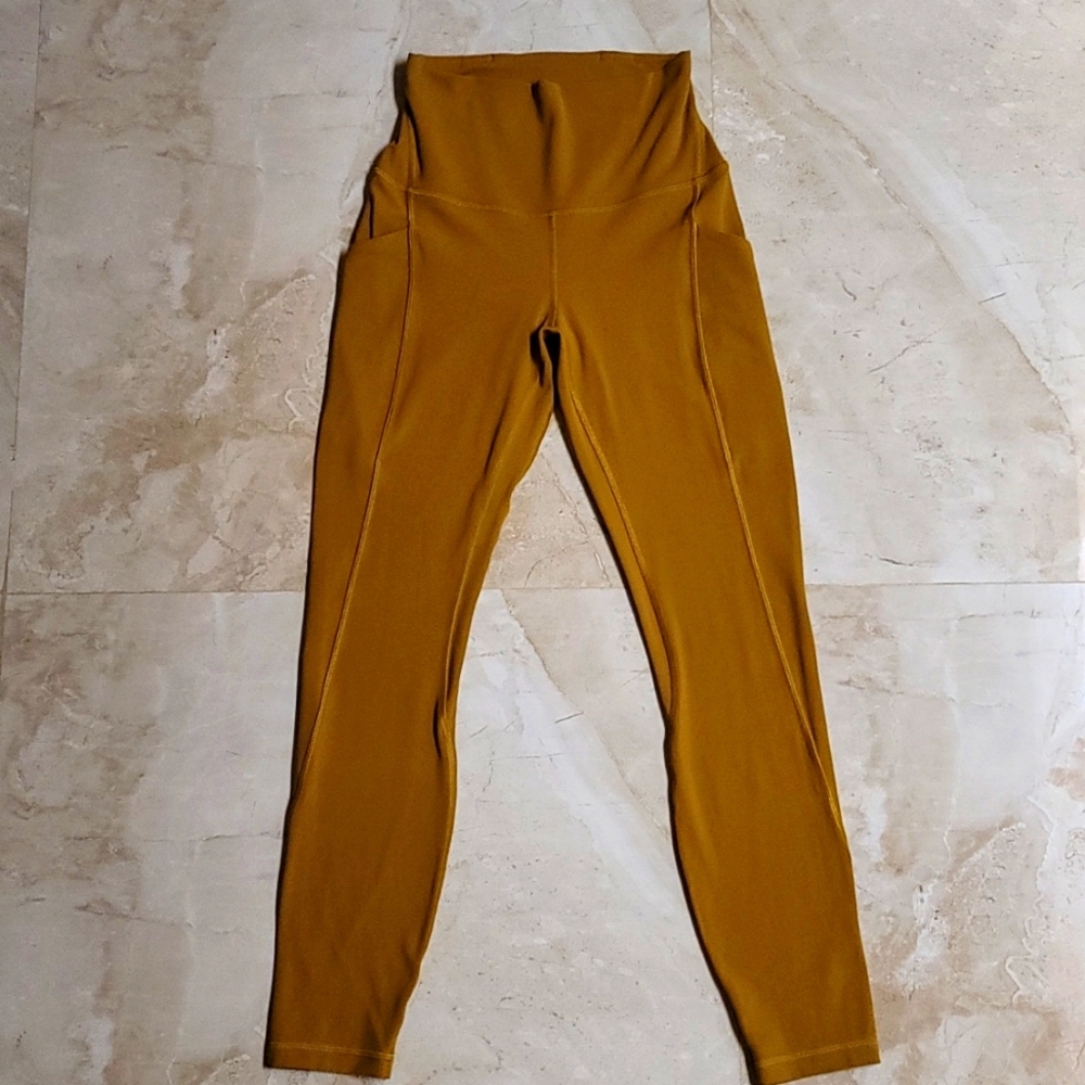 Lululemon mustard yellow high rise align leggings with pockets.